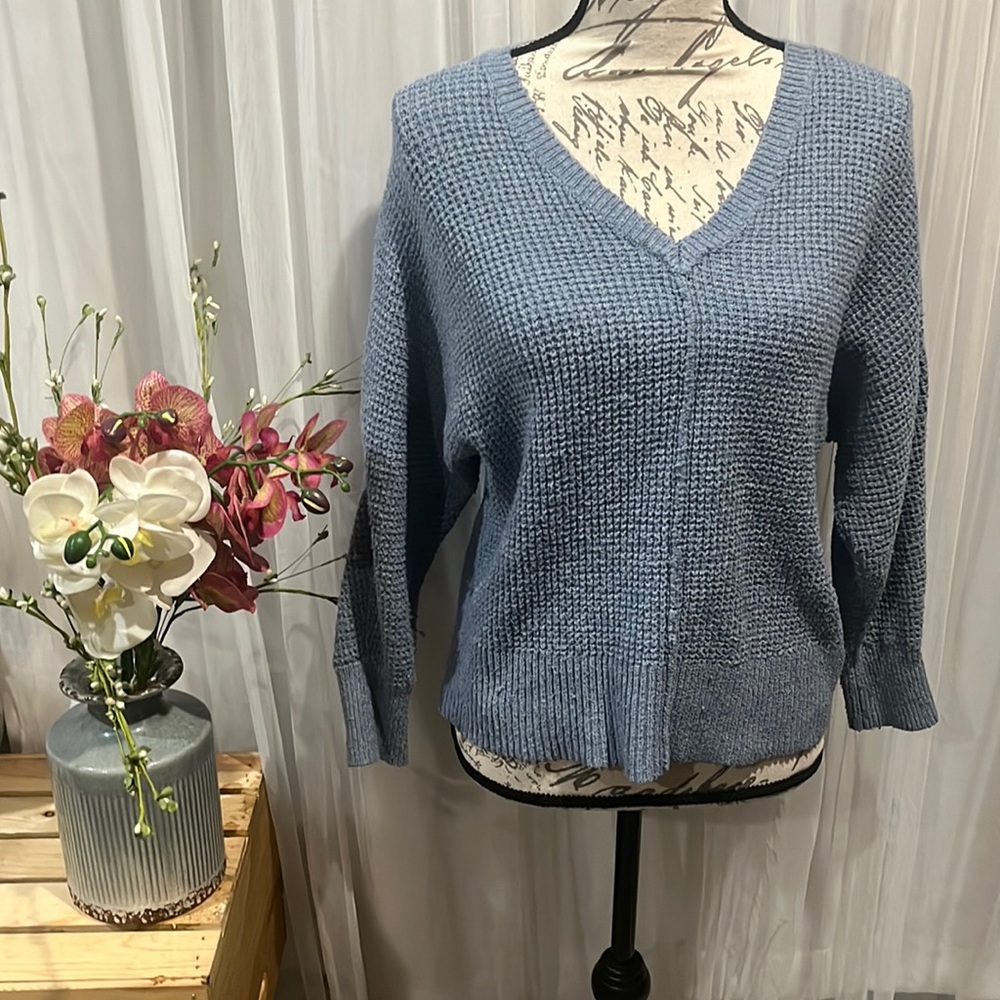The brand is pink rose in a blue in the size medium.
